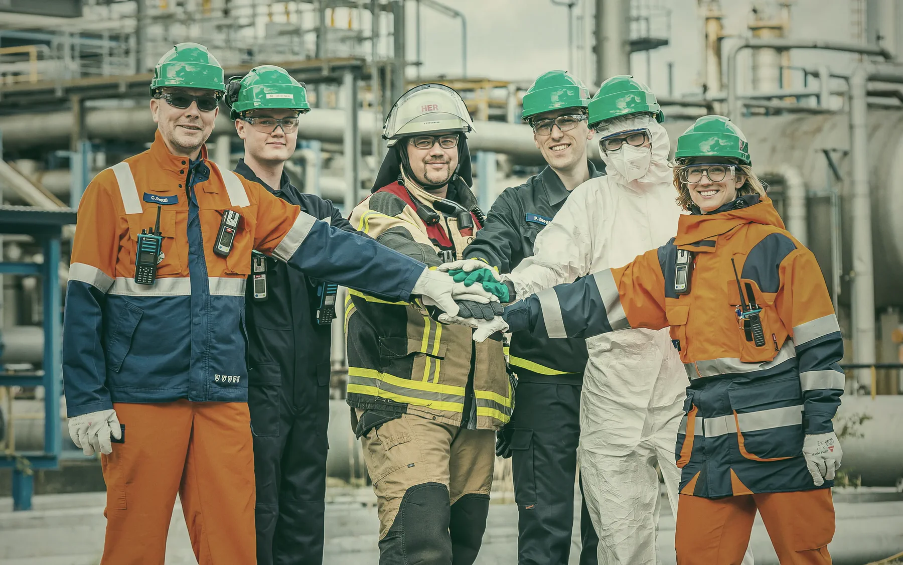 HER team in protective clothing at the refinery